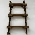 Ladder upward angle showing wood rungs and rope supports