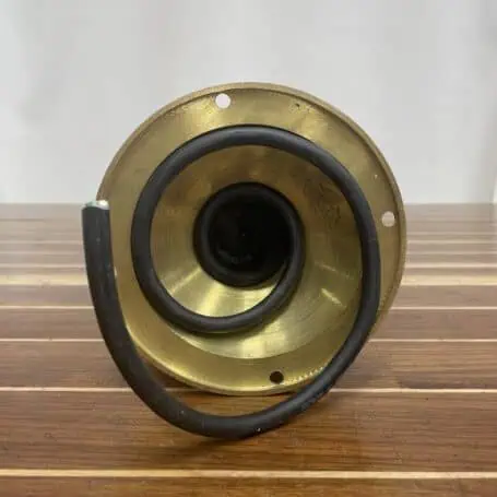 Underside of a brass nautical pedestal light displaying the wiring and mounting base.