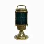 Brass nautical post light with green Fresnel lens shown from front view on white background