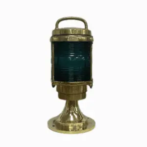 Brass nautical post light with green Fresnel lens shown from front view on white background