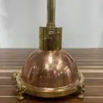Close-up of Copper and Brass Nautical Pendant Light showing brass collar and mounting hardware