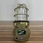 Back view showing wiring and mounting holes on brass sconce base
