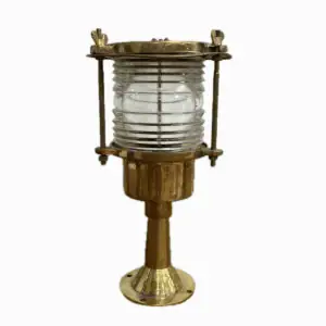 Front view of vintage brass post light on white background