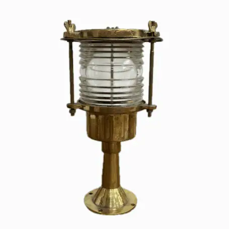 Front view of vintage brass post light on white background