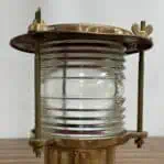 Close-up of clear Fresnel lens on vintage brass post light