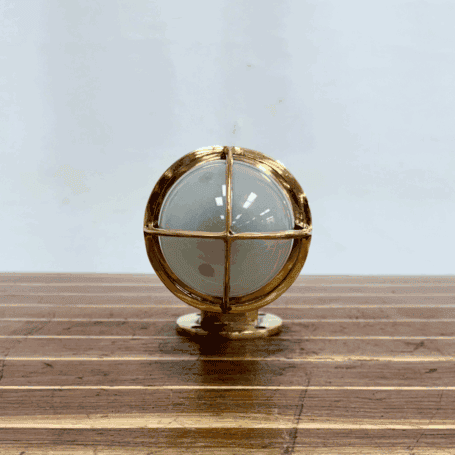 Solid Brass Dock Light with Frosted Glass Globe (4) Bottom view looking up at the frosted globe and brass cage