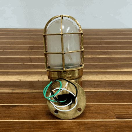 Solid Brass Dock Light with Frosted Glass Globe (6) Bottom of the light showing mounting plate, wiring, and bolt holes