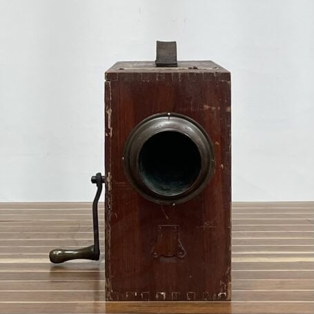 Vintage Norwegian Pattern Rotary Foghorn - Non-Functional (2) Front view of vintage rotary foghorn showing the hand crank and worn wood surface.
