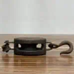 side view of single sheave wood block pulley lying flat