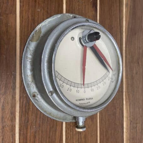Vintage Nautical Clinometer - Kompas Rijeka Yugoslavia Ship Instrument Angled view of Kompas Rijeka nautical clinometer with visible wear and grime