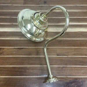 side profile of polished brass marine wall sconce with curved arm