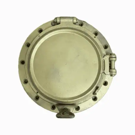 Overhead view of iron ship porthole with solid cover shut