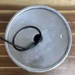 Top view of industrial pendant light canopy with exposed wiring
