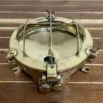 brass ceiling light top view with protective cage removed