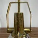 Close-up of aged brass body on ship salvage pendant light showing patina and wear