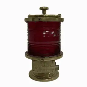 Red fresnel post light with brass housing and locking lid