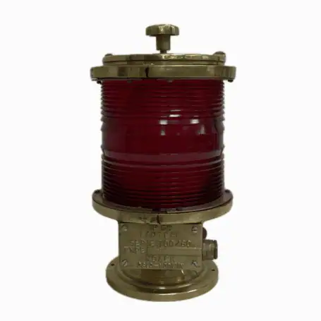 Red fresnel post light with brass housing and locking lid