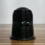 Green ribbed glass lens from salvaged ship light – close-up