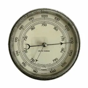 Kelvin Hughes Marine Barometer close-up of cream dial with black markings and compensated scale