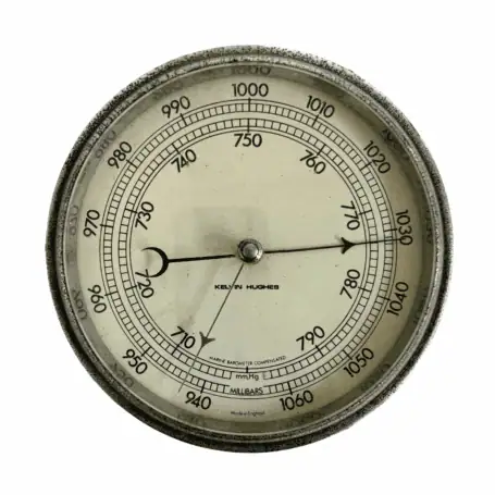 Kelvin Hughes Marine Barometer close-up of cream dial with black markings and compensated scale