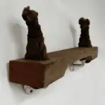 Side angle of rope ladder shelf with worn wood and tied rope ends