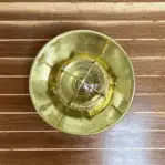 Overhead view of optional 13-inch brass rain cap for marine ceiling light.