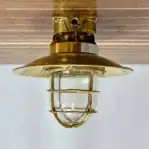 Side profile of Solid Brass Marine Ceiling Light showing protective brass cage.