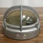 ide view of vintage aluminum 2 bar ceiling light with conduit plugs