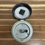 Inside view of vintage Polaris brass ship clock with battery movement