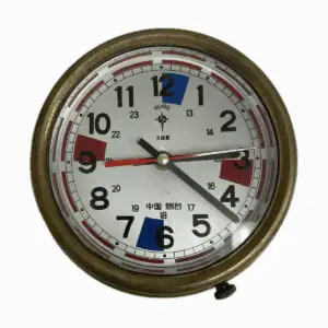 Front face of vintage Chinese radio room clock with Polaris branding
