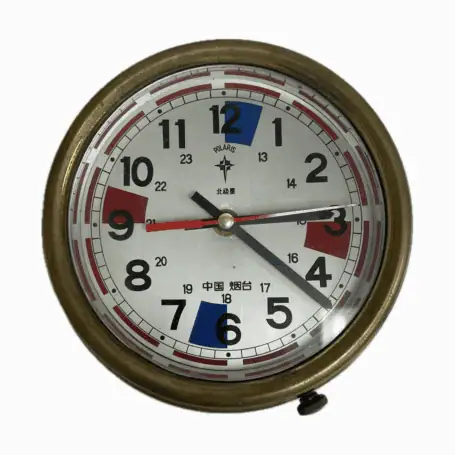 Front face of vintage Chinese radio room clock with Polaris branding