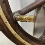 Close-up of brass handle on marine steering wheel display