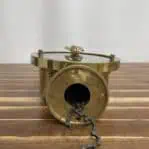 Bottom view of brass engine order device showing original control chain