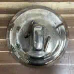 Top view of brass ship bell showing mounting hardware