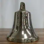 Side profile of brass ship bell showing wear and shape