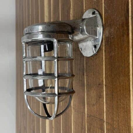 Vintage Aluminum Nautical Bulkhead Light - Salvaged Ship Fixture Wall-mounted salvaged aluminum cage light with glass dome