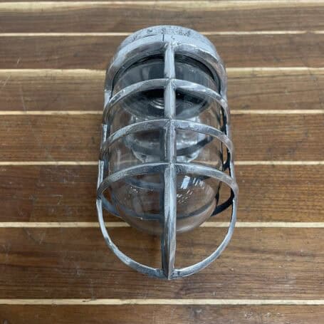 Vintage Aluminum Nautical Bulkhead Light - Salvaged Ship Fixture Front cage view of vintage aluminum nautical bulkhead light