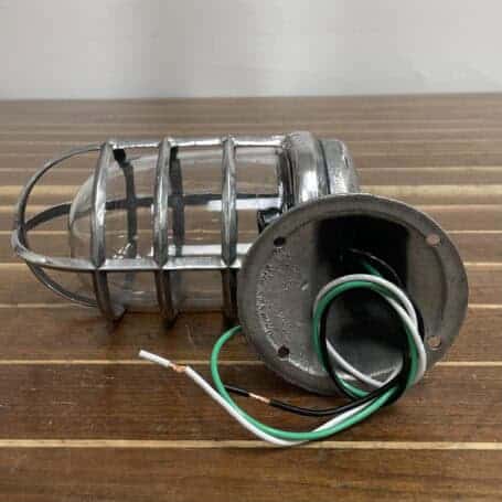 Vintage Aluminum Nautical Bulkhead Light - Salvaged Ship Fixture Wiring detail of vintage aluminum nautical bulkhead light with short cage