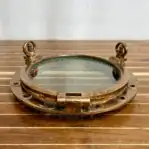 Hinged Window Detail on Oversized Brass Porthole