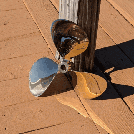 13 Inch Brass Propeller 04 Vintage Brass 13-Inch Boat Propeller top view propped up