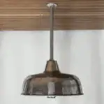Side profile showing aluminum hood and clear glass globe
