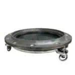 Side profile of salvaged aluminum ship porthole showing recessed glass and frame depth