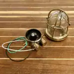 Disassembled light showing cage, globe, and base components
