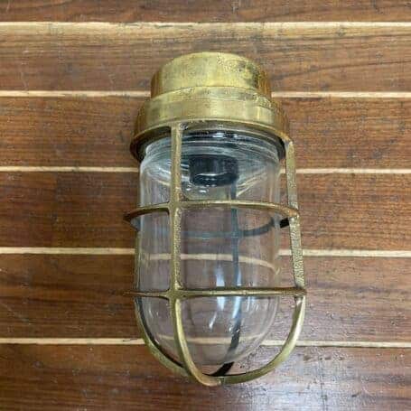 Brass Nautical Wall Light with Cage and Glass Globe 02 brass nautical wall light with cage and glass globe front view