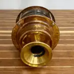 Bottom view of brass pier light showing wiring setup, designed for easy outdoor installation on docks or marinas.