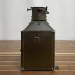 Side view of nautical copper lantern showing mounting bracket and patina