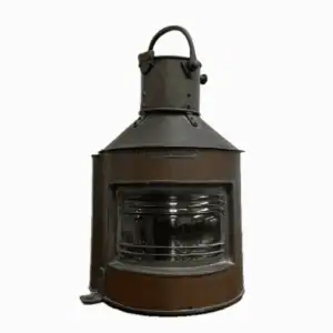 Front view of nautical copper lantern with clear lens and red insert visible