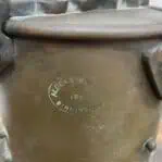 Close-up of maker's mark on nautical copper lantern stamped Alderson & Gyde 1942 Birmingham