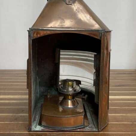 Vintage Copper Ship Lantern - Starboard Fresnel Light with Original Oil Chamber Interior of vintage copper ship lantern with original oil chamber and Fresnel lens