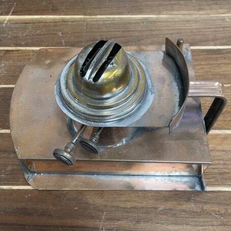 Vintage Copper Ship Lantern - Starboard Fresnel Light with Original Oil Chamber Original oil chamber from vintage copper ship lantern, removed and placed on table